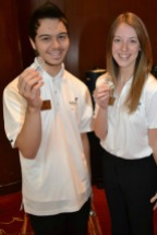 Two SkillsUSA Indiana State Officers, Jacob Weber and Emily Stephenson, proudly held up their National Statesman Award pin.